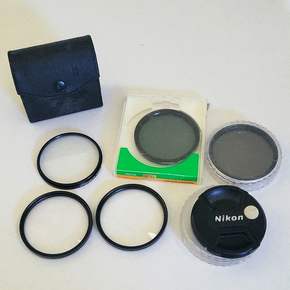 Lot 5 tiffen camera 67mm lens. Nikon 67mm lens cover and extra protective cases.